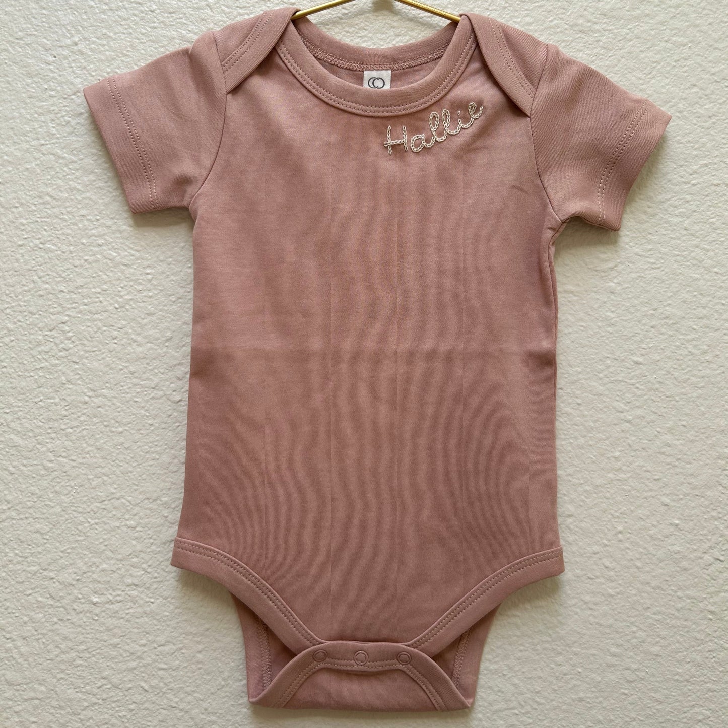 HAND EMBROIDERED NAME ONESIE